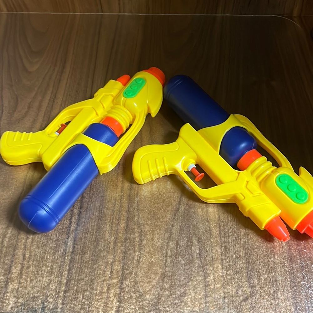 Two cool water guns for the beach the pool and to use on hot days.